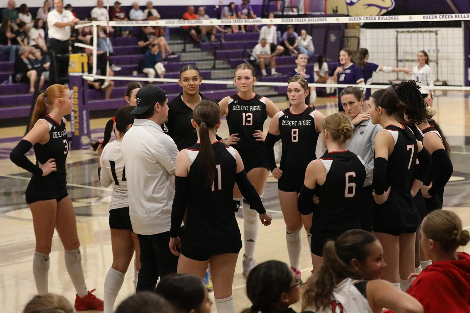 Coach talking to the team in the huddle